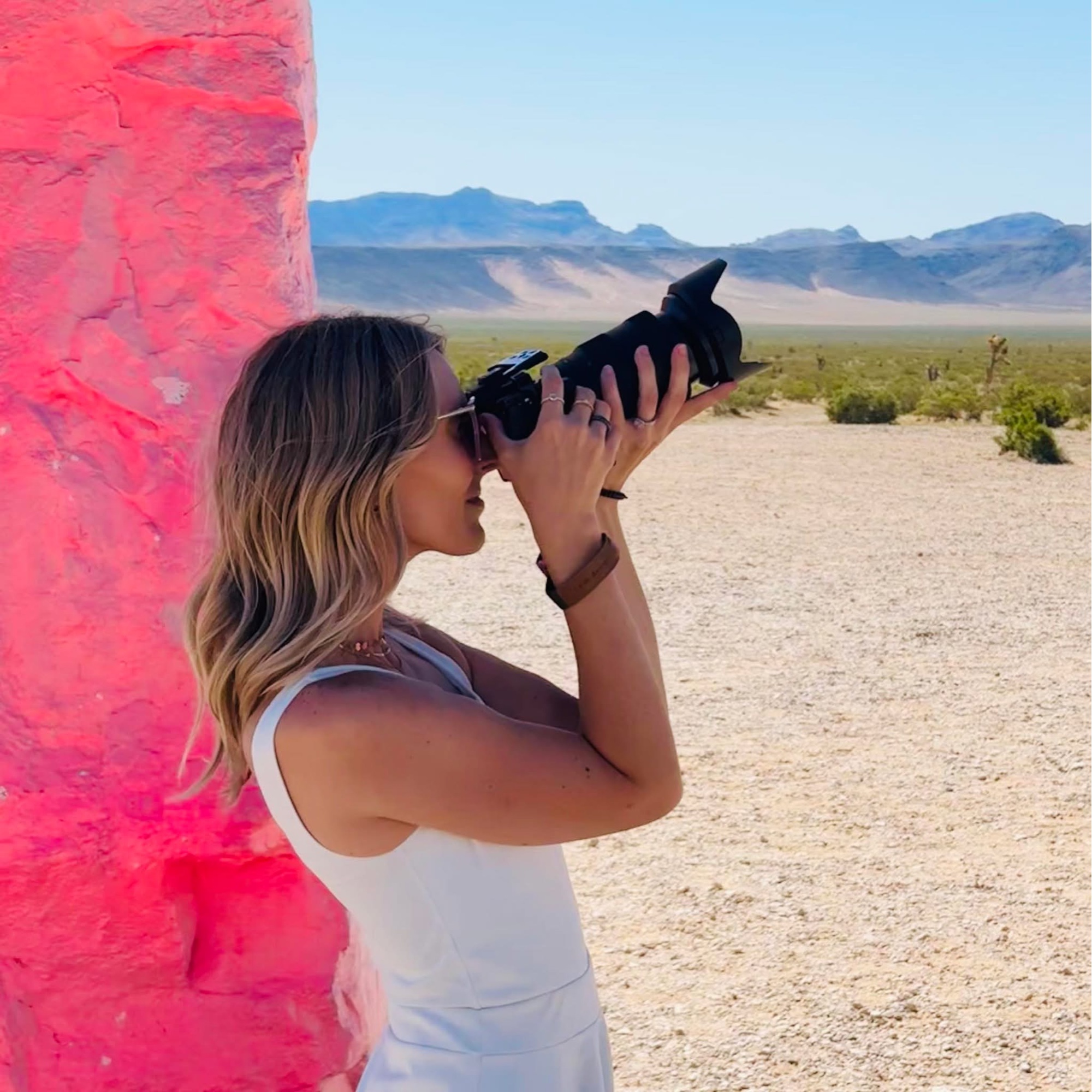 Nicole shooting with a mirrorless camera in the Nevada desert